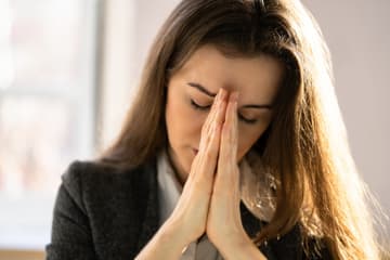 Woman praying since she has a love for God