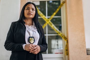 Private investigator looking at crime scene 