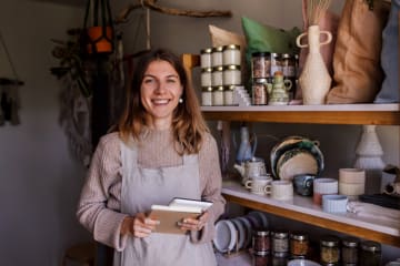 Female entrepreneur taking inventory in her store
