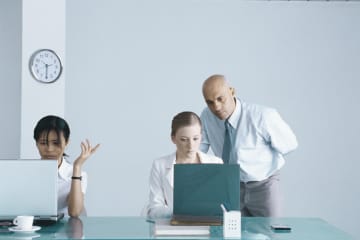 Business manager micromanaging his employee