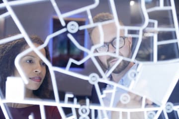 Professionals looking at futuristic display