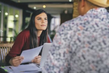 A doctoral student conducting an interview to collect quantitative data 