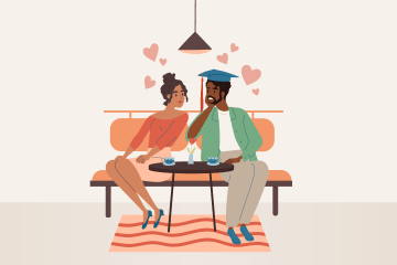 Two people sitting next to each other on a bench surrounded by hearts