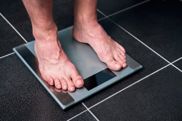 Feet standing on scale