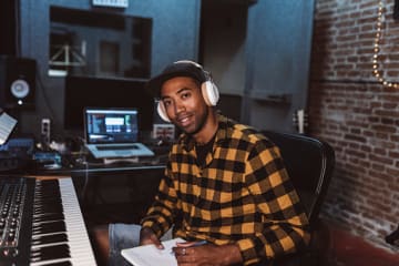 Composer writing music in studio