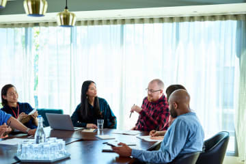 people sitting around a table talking