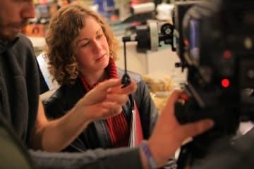 Film producer working on set