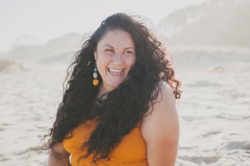 Smiling woman celebrating freedom in Christ