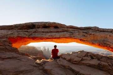 Man sitting in awe of God and the beauty of nature