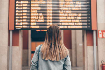 Woman patiently waiting at train station
