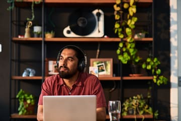 Man learning and growing from online educational course in home office