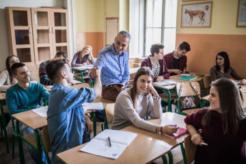 A charismatic teacher engaging with students