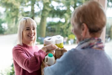 Woman showing God's goodness by helping a neighbor
