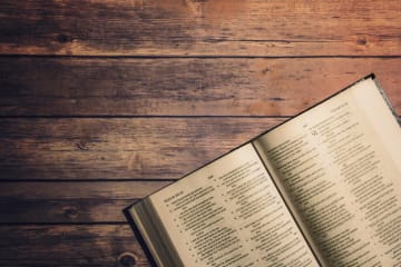 Old Testament Bible on a wooden table