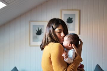 mother comforts her child