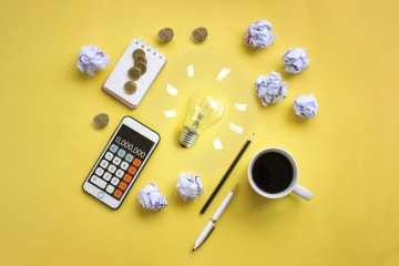 Financial planning set-up with a calculator and notepad