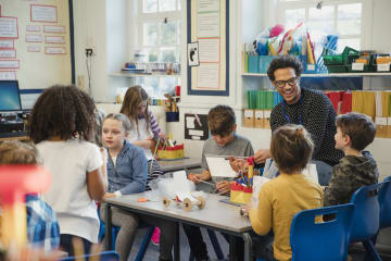 Elementary students completing a project