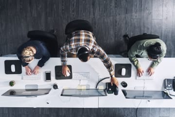 Men and women working on computers 