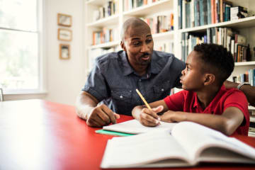 dad helping his son with homework
