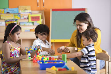 preschool teacher with children