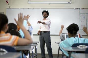 teacher at the front of the classroom