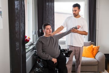 Physical therapy degree graduate helping a patient