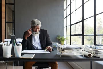 businessman studying some papers