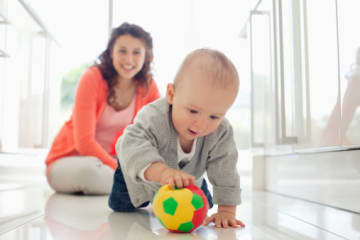 A childhood development specialist helping a child 