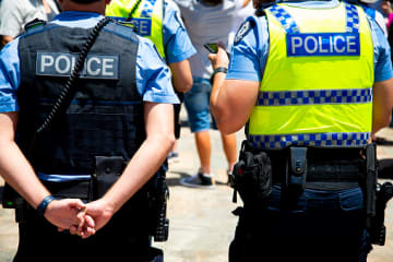 Two police officers of different ranks standing next to each other