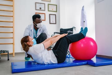 Sports Psychologists helping a person with exercise