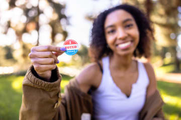 College-aged female with I Voted sticker
