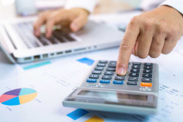 CPA/ Accountant calculating 