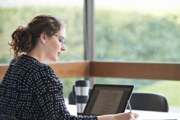 Woman studying and working on her online degree