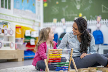 Teacher helping student with special needs