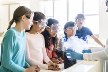 students doing a science experiment in class