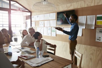 A group of people in a business meeting