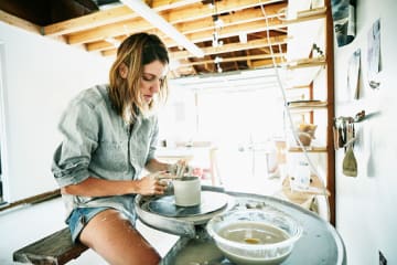 Woman playing with clay