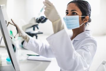 Scientist working in the laboratory - stock photo