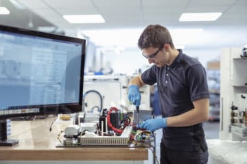 Engineering working on circuit board