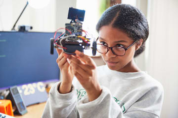 Engineering student checking her project.