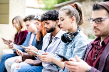 College students on their phones.