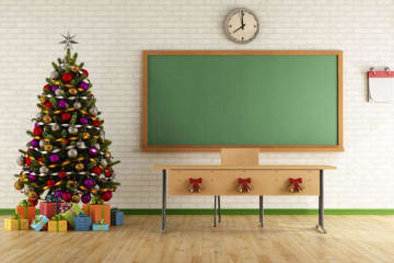 Christmas tree next to blackboard