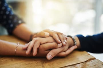 two people holding hands