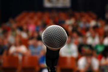 Microphone in front of a crowd