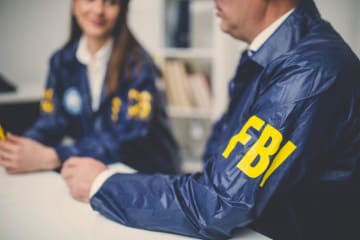 FBI agents sitting together at a table