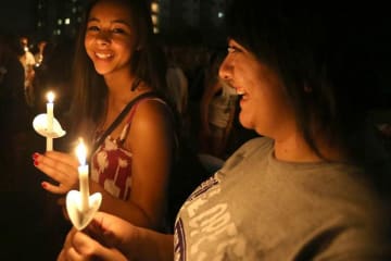 Two girls with candles in hand