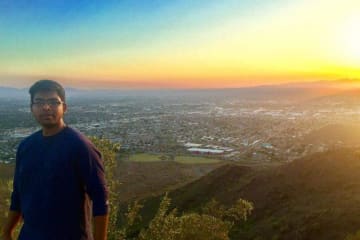 person standing on mountain