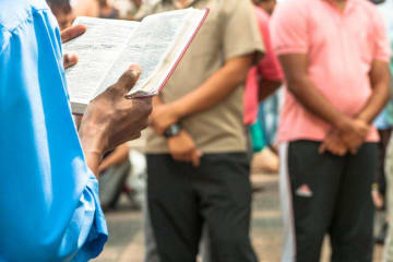 A person preaching in the street