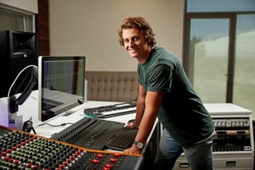 A student working at a soundboard