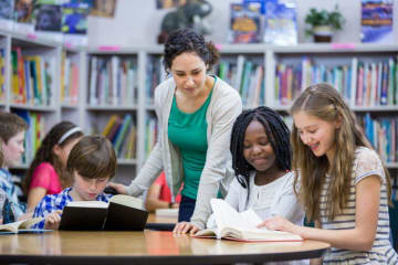 A teacher reading to her students